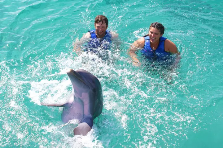 a man riding a wave on a surfboard in the water