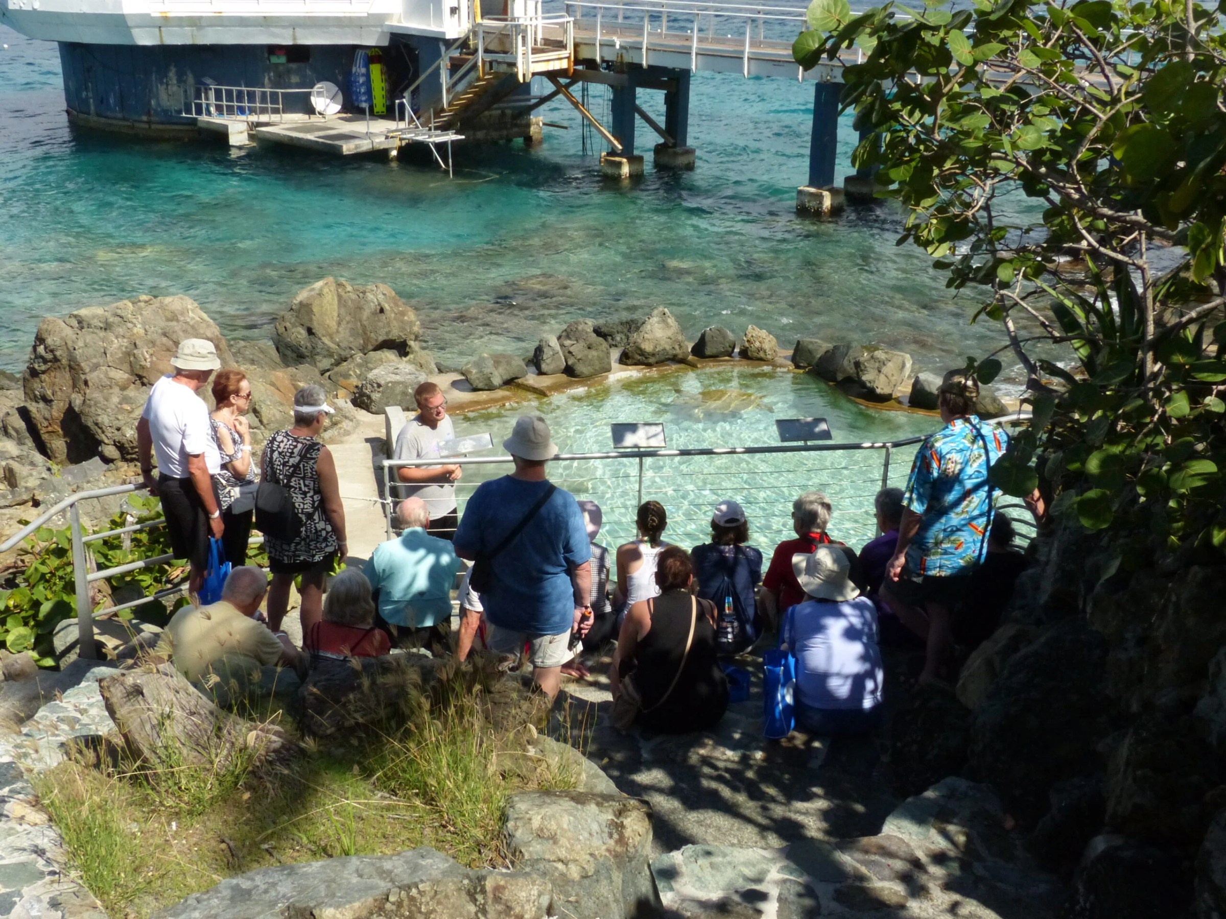 a group of people in a boat on a body of water