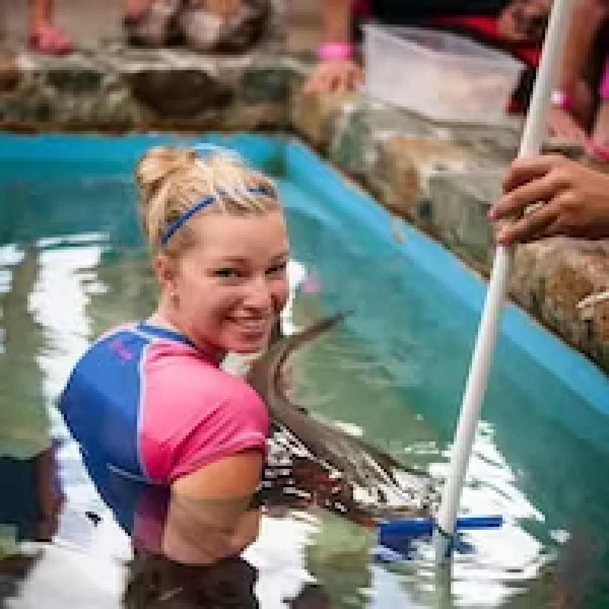 a group of people riding on the back of a boat