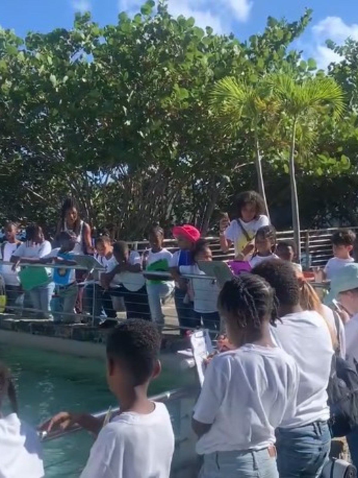 a group of people standing in front of a crowd